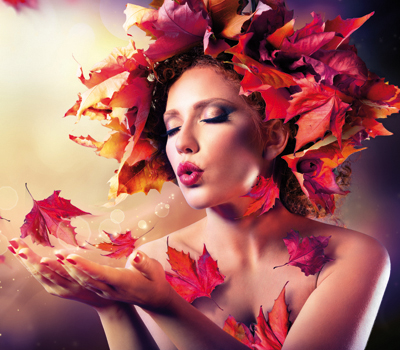 Autumn woman blowing red leaves - Beauty Fashion Model Girl